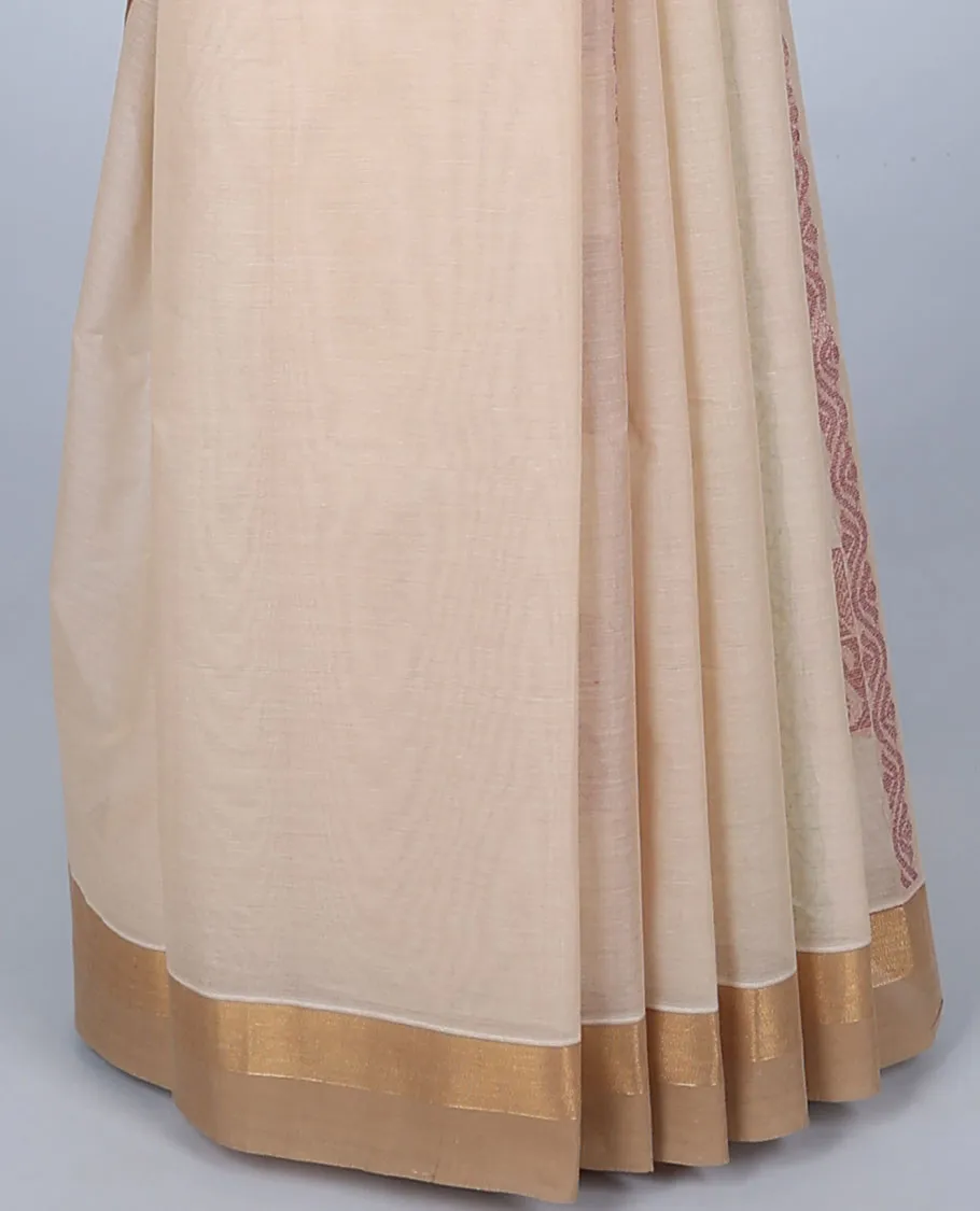 Cream cotton saree with unique designs, plain border & pallu of intricate designs