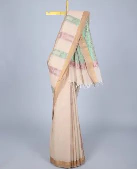 Cream cotton saree with unique designs, plain border & pallu of intricate designs