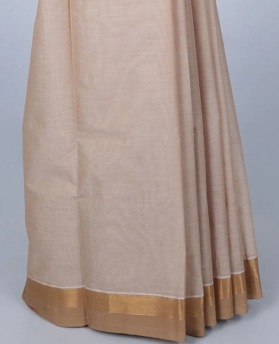 Cream cotton saree with unique designs, plain border & pallu of intricate designs