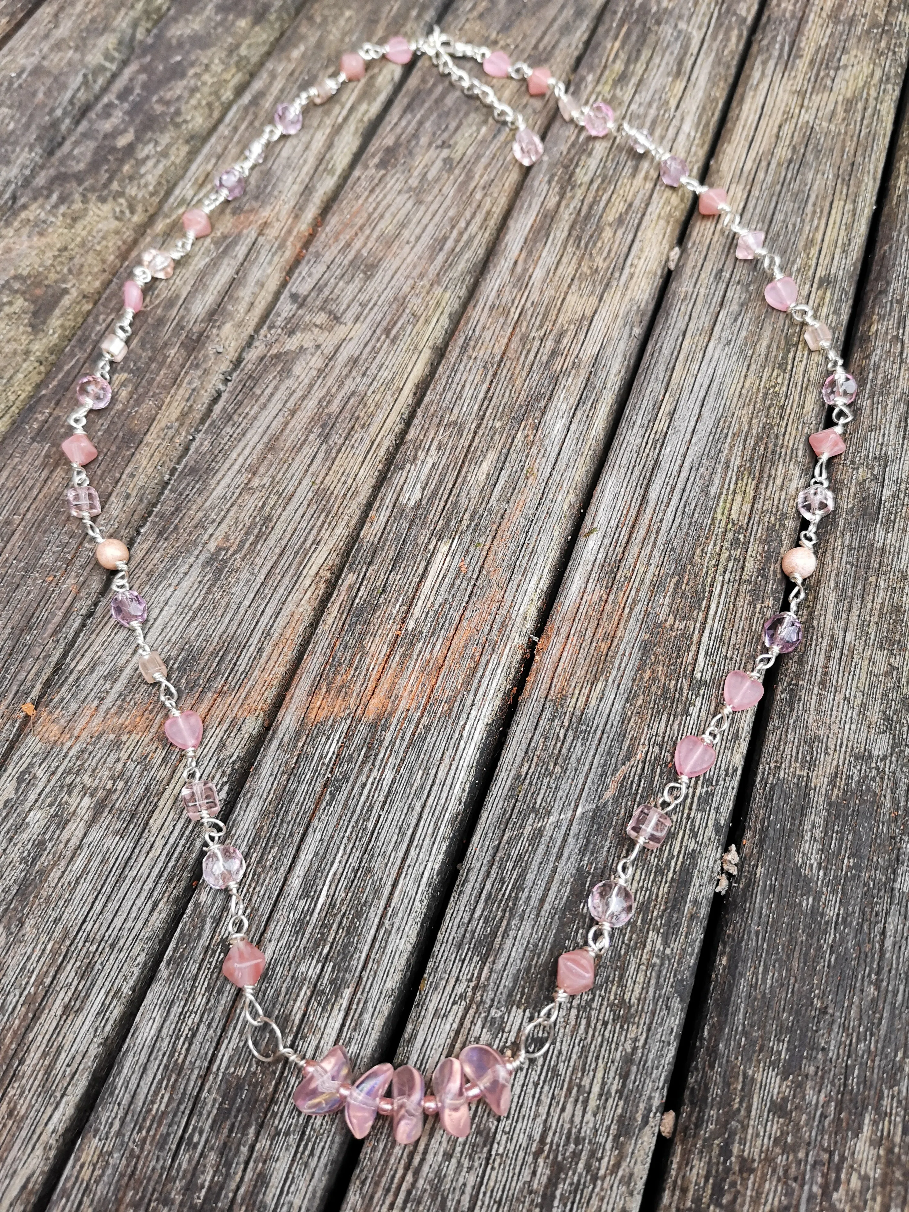 Cupid, pink crystals and glass beads  necklace with a dainty bar of wavy disc beads