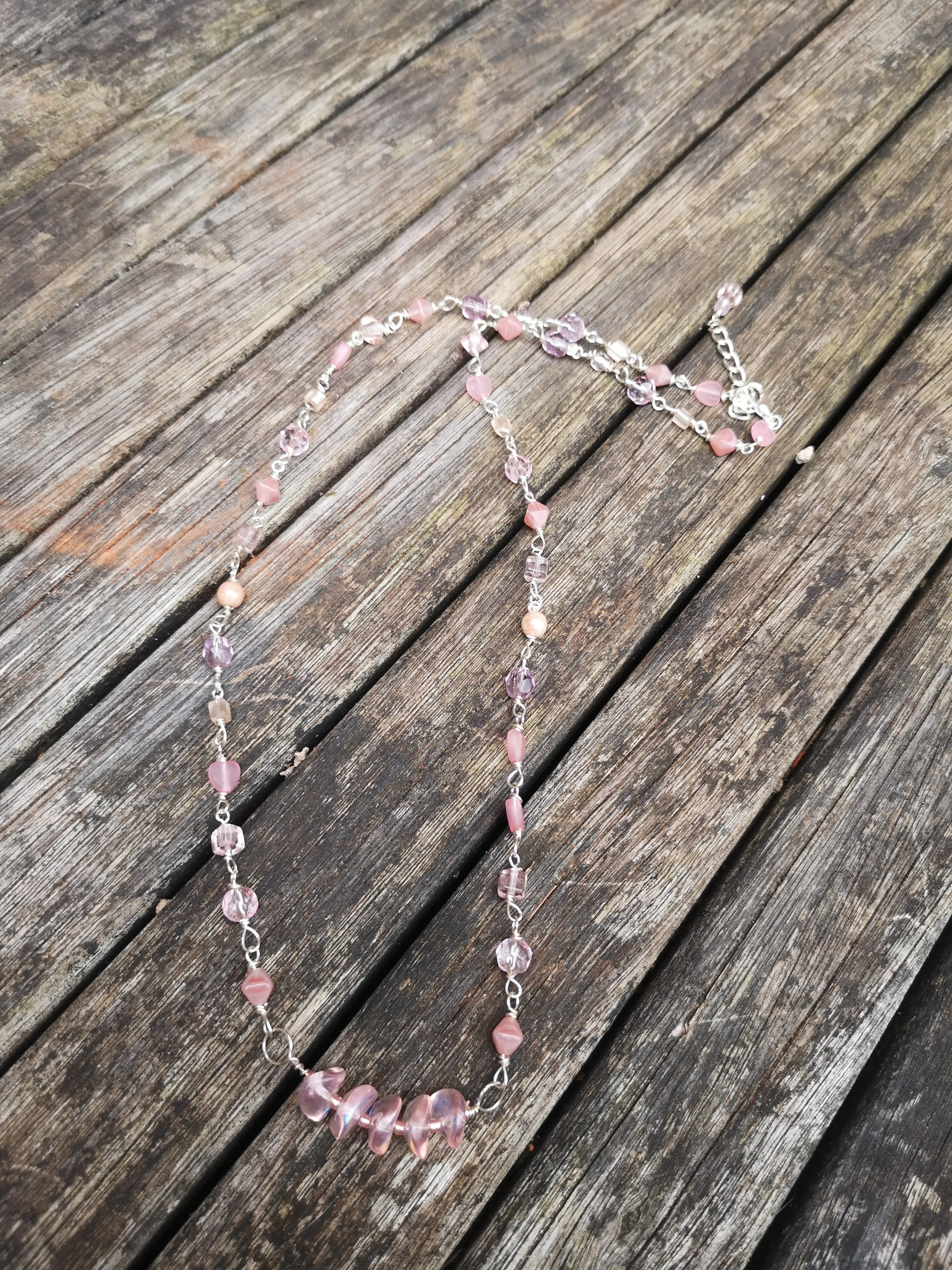 Cupid, pink crystals and glass beads  necklace with a dainty bar of wavy disc beads